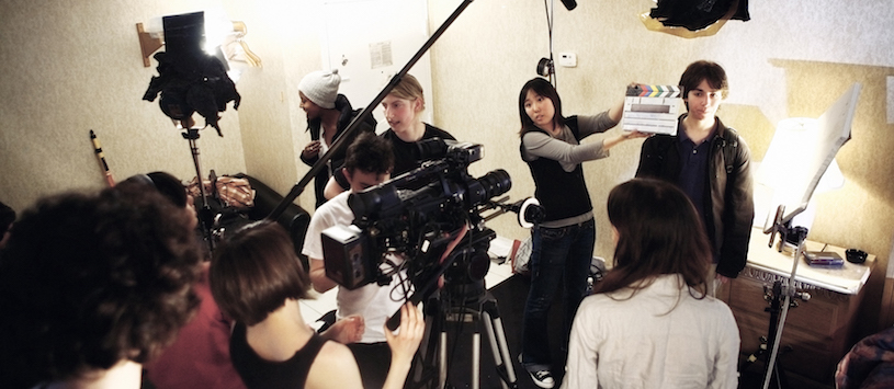 Students on a film set who are part of video production programs